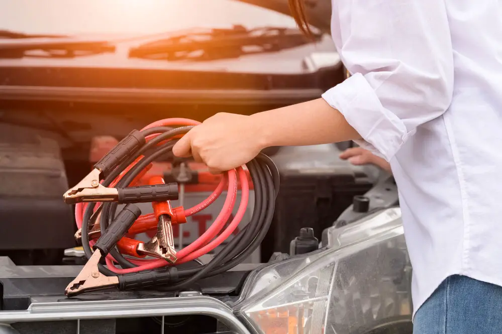 Hand-holding battery cables